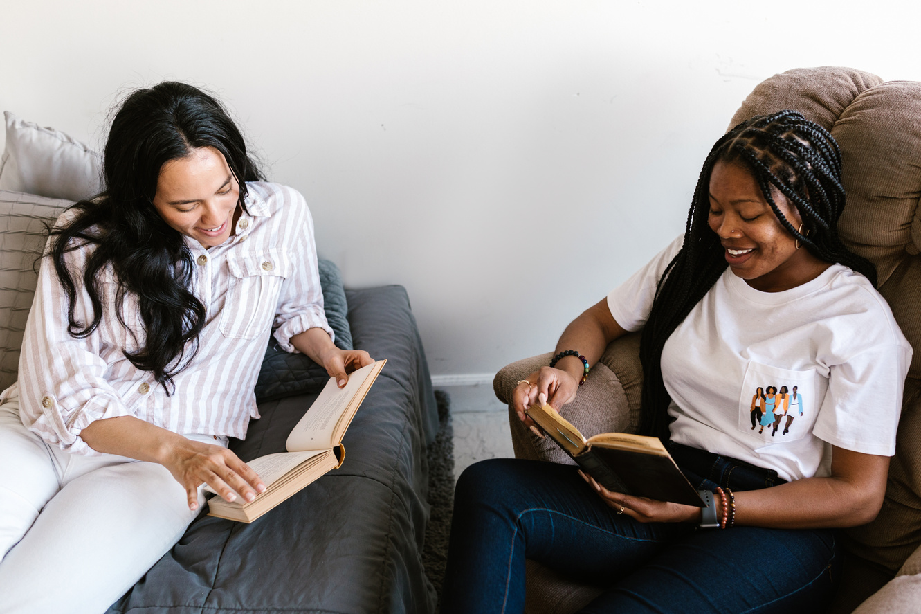 Young Women Reading Books Together